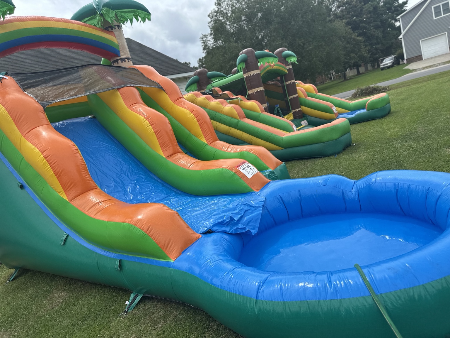 Tropical water slide with a large blue splash pool